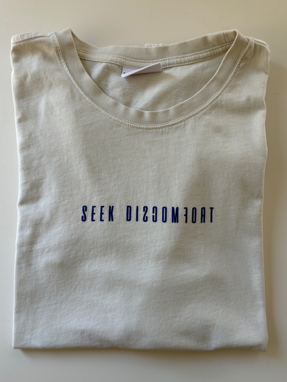 Seek Discomfort Off White Graphic T-Shirt